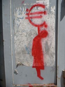 Red Euro currency symbol with stick figure corpse hanging from it