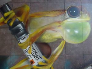 Bulbous frog with oversized marker, on a mural in Luxembourg
